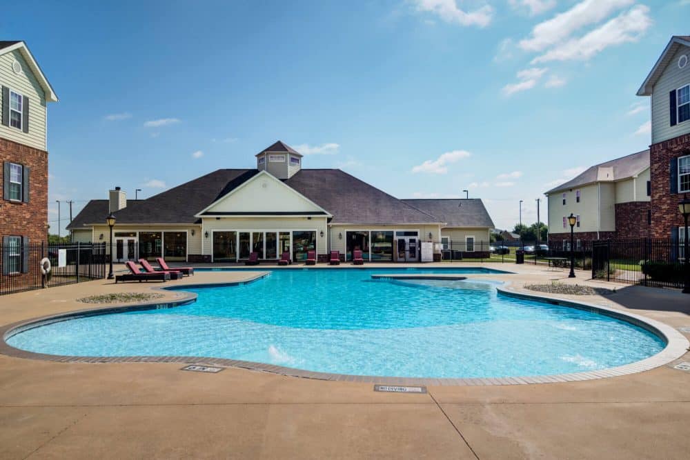 mustang village off campus apartments near midwestern state university msu resort style pool resident clubouse exterior
